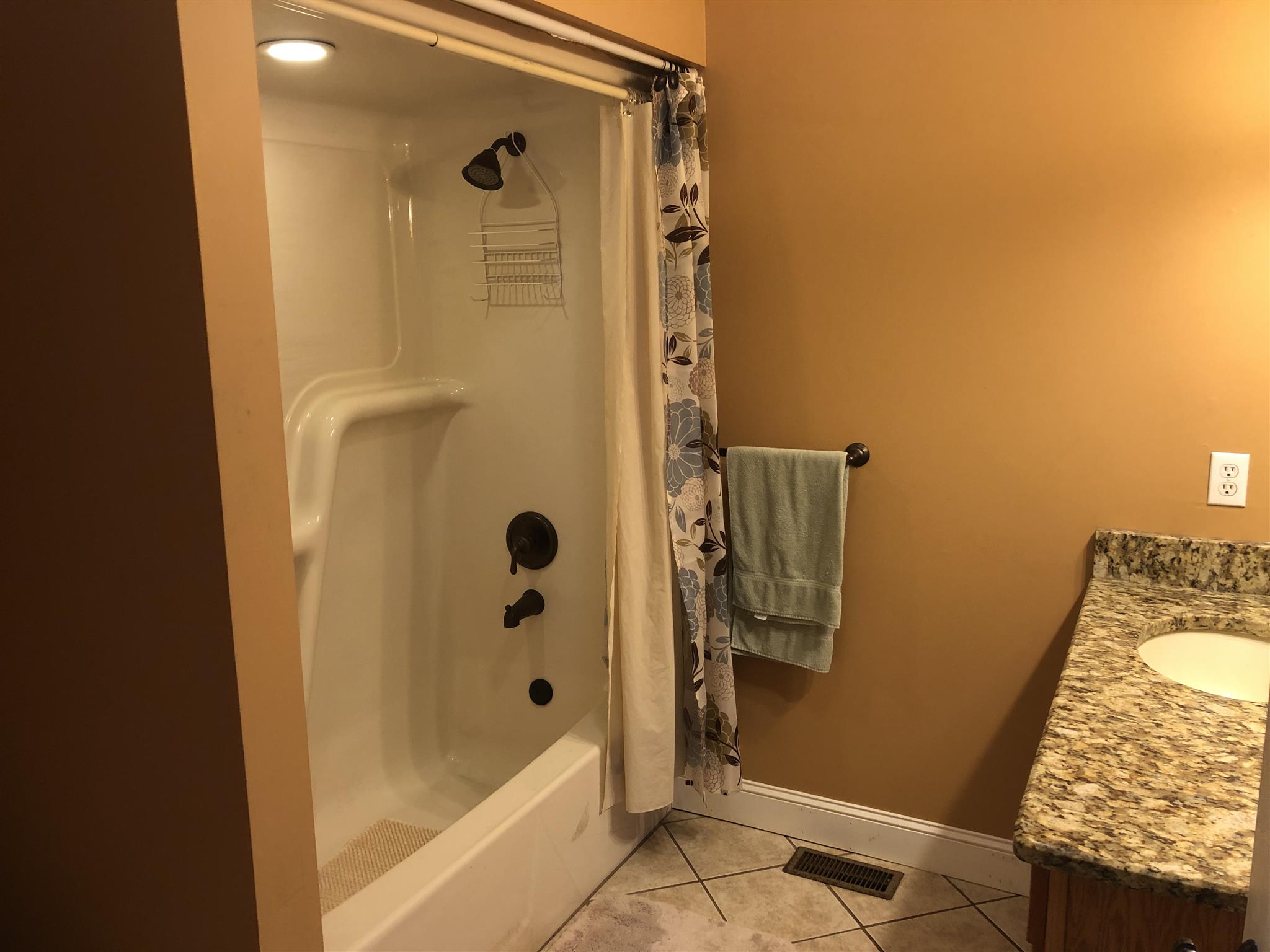 374 Eagle Lake Road Coalmont, TN 37313 - Photo 25 of 28 a bathroom with a granite countertop shower and a sink