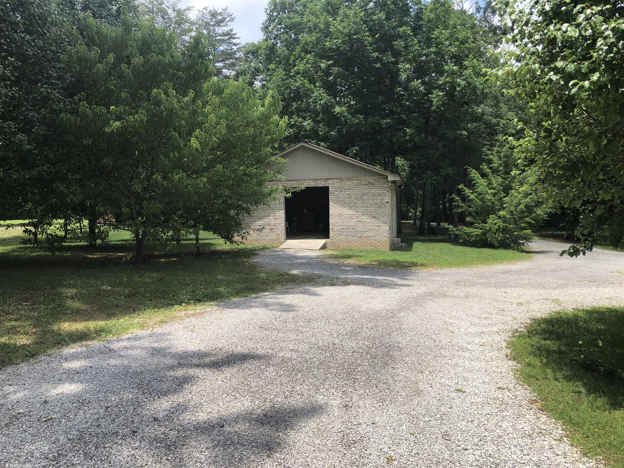 374 Eagle Lake Road Coalmont, TN 37313 - Photo 28 of 28 a front view of a house with a yard and lake view