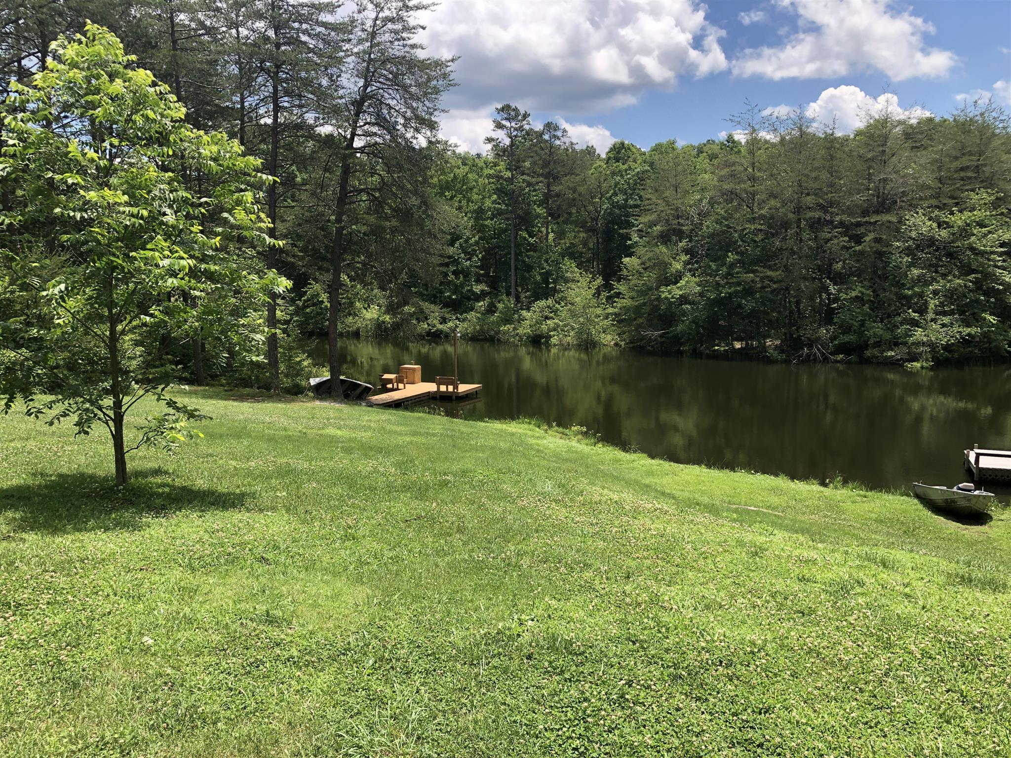 374 Eagle Lake Road Coalmont, TN 37313 - Photo 4 of 28 a view of a lake with houses in the background