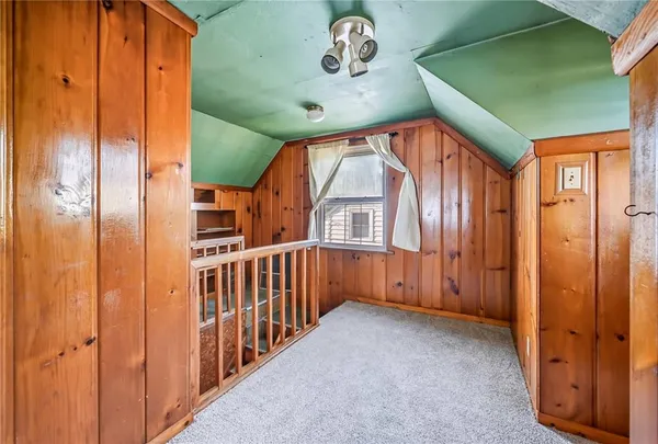 a view of a bathroom with a shower and a sink