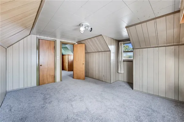 a bathroom with a shower and a sink
