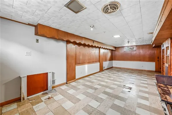 a bathroom with a sink a mirror and a shower