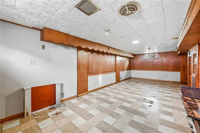 a bathroom with a sink a mirror and a shower