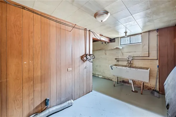a bathroom with a sink a mirror and shower curtain