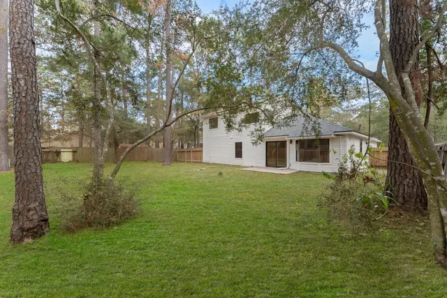 a big yard with large trees