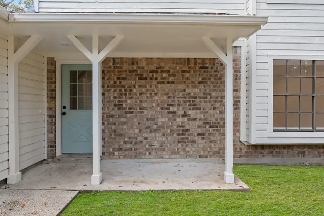 a view of house with backyard