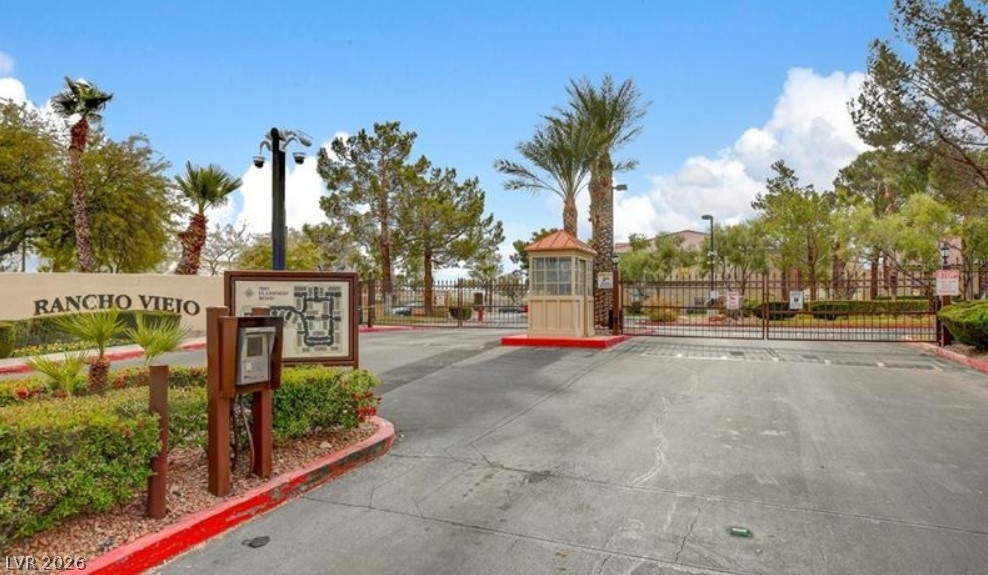 7885 West Flamingo Road, Unit 1008 Las Vegas, NV 89147 - Photo 4 of 29 Secure community entry with a guarded gatehouse welcomes residents to Rancho Viejo.