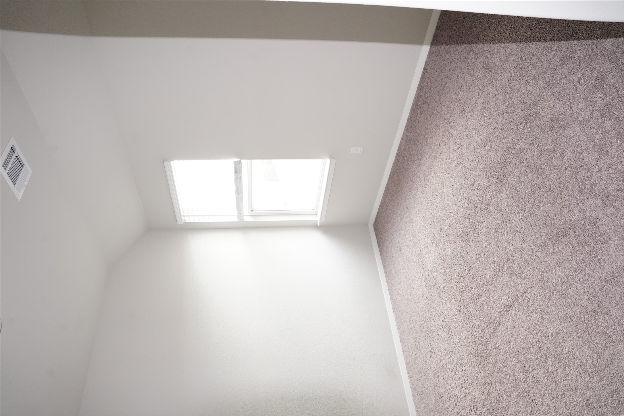 117 Crescent Street Georgetown, TX 78626 - Photo 16 of 38 A well-lit room with soft carpet and natural illumination from a corner window.
