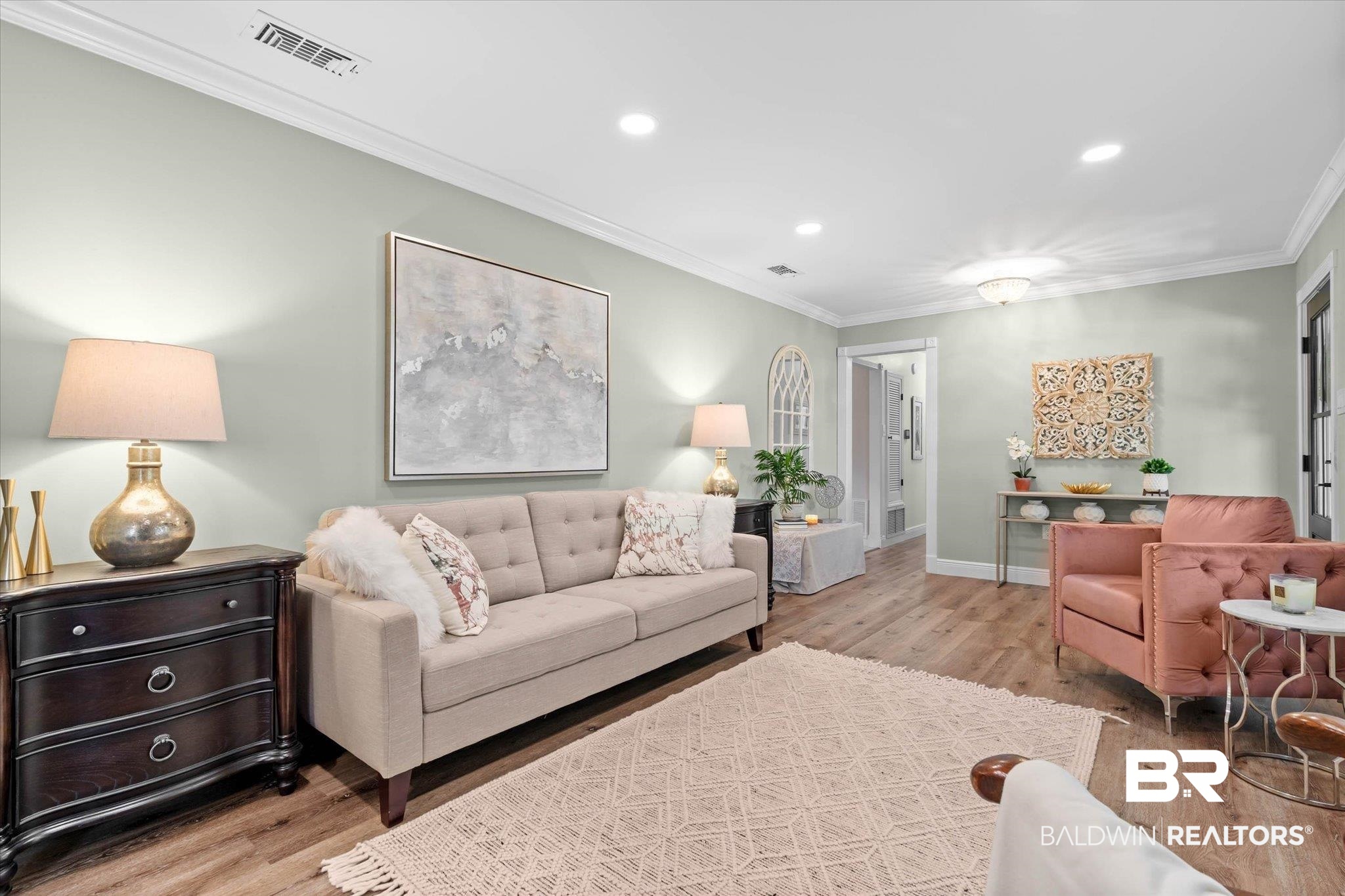 101 Ann Street Daphne, AL 36527 - Photo 4 of 38 Spacious living area featuring light wood-finish flooring, recessed lighting, crown molding, and a neutral wall color