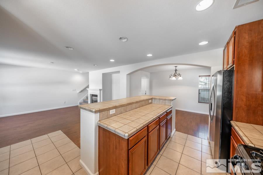 1680 Spicewood Circle Reno, NV 89523 - Photo 13 of 39 a kitchen that has a lot of cabinets in it