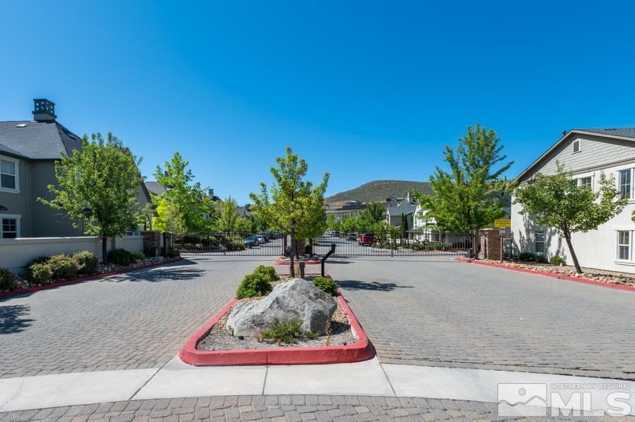 1680 Spicewood Circle Reno, NV 89523 - Photo 34 of 39 a palm tree sitting in a yard with a house