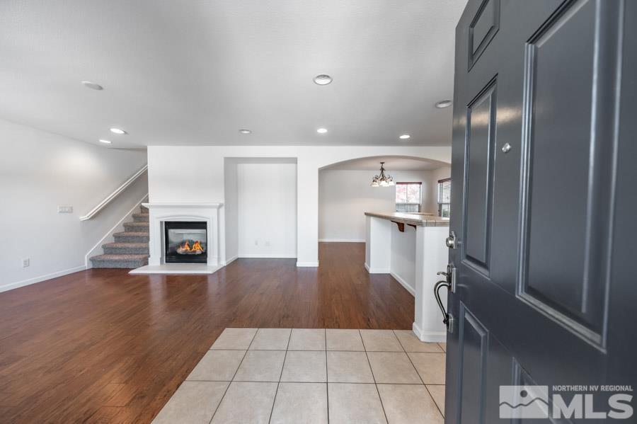 1680 Spicewood Circle Reno, NV 89523 - Photo 5 of 39 a kitchen with granite countertop a refrigerator and a stove
