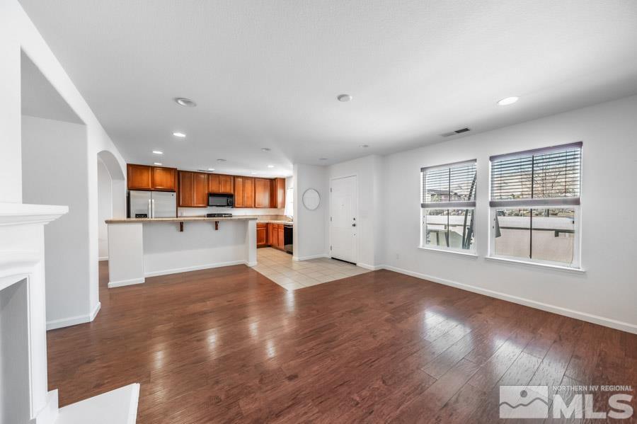 1680 Spicewood Circle Reno, NV 89523 - Photo 8 of 39 a view of a kitchen with wooden floor and a window