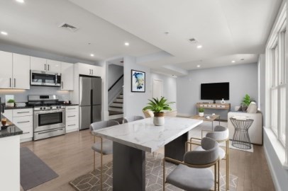 167 Charles Street, Unit 4 Waltham, MA 02453 - Photo 2 of 9 a living room with stainless steel appliances furniture and a kitchen view