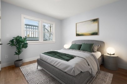 167 Charles Street, Unit 4 Waltham, MA 02453 - Photo 5 of 9 a bedroom with bed and a window