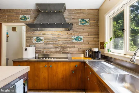 a spacious bathroom with a double vanity sink and a mirror