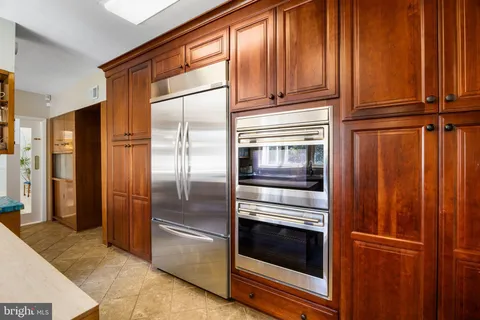 a view of a house with sitting area and potted plants