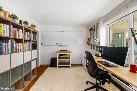 a view of a yard with potted plants