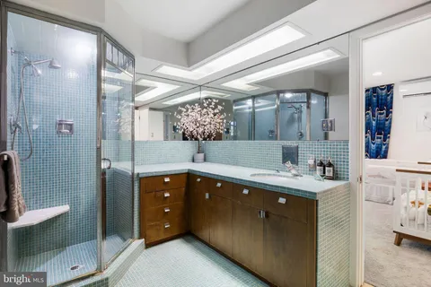 an aerial view of residential houses with yard