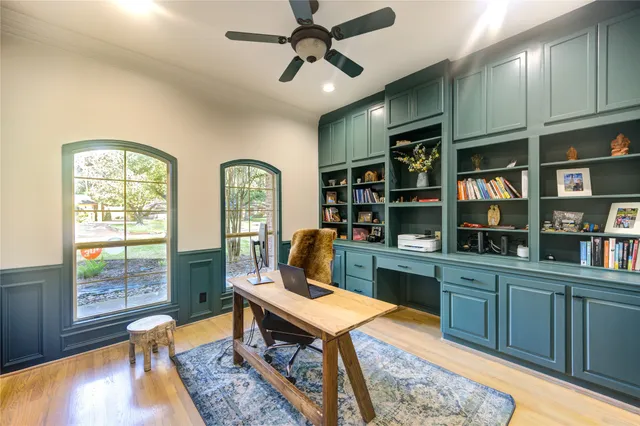 a room with furniture a rug and a chandelier