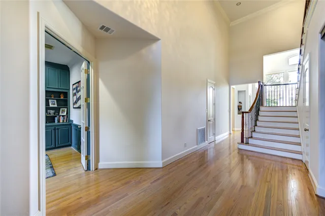 a view of entryway with wooden floor and stairs