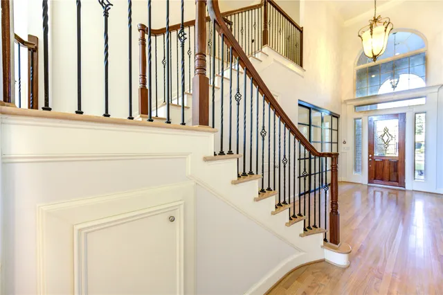 a view of an entryway with wooden floor