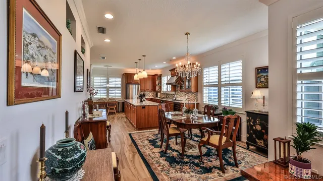 a view of a dining room with furniture window and outside view