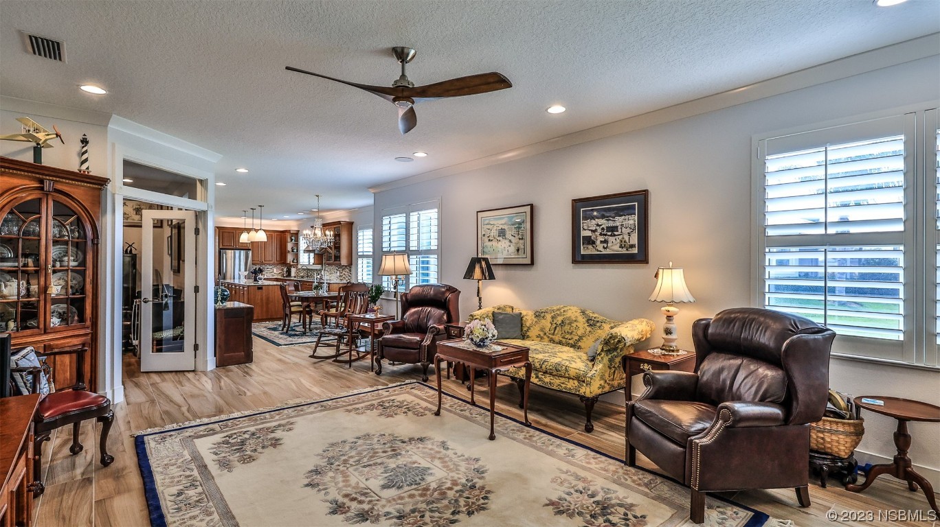 606 Midfield Loop Edgewater, FL 32132 - Photo 17 of 42 a living room with furniture and a window