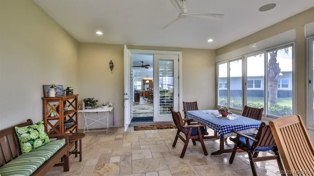 a dining room with furniture a rug and wooden floor