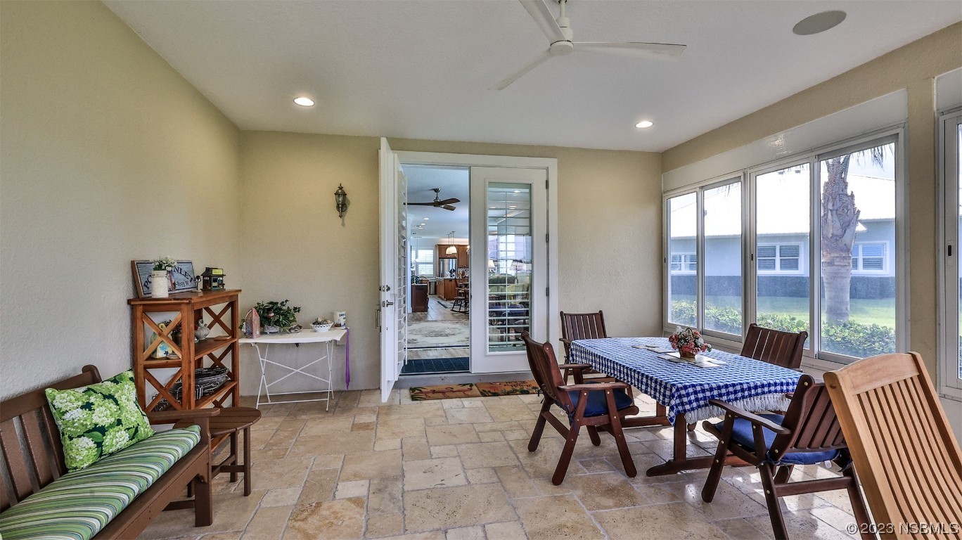 606 Midfield Loop Edgewater, FL 32132 - Photo 20 of 42 a dining room with furniture a rug and wooden floor