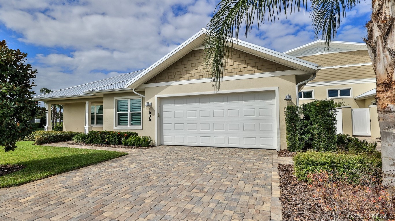 606 Midfield Loop Edgewater, FL 32132 - Photo 2 of 42 a front view of house with yard and trees