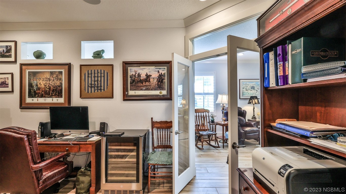 606 Midfield Loop Edgewater, FL 32132 - Photo 22 of 42 a view of a workspace with furniture and wooden floor