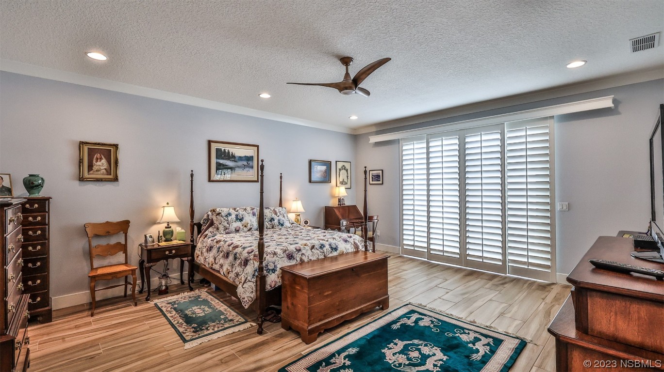 606 Midfield Loop Edgewater, FL 32132 - Photo 25 of 42 a bed room with furniture and a window