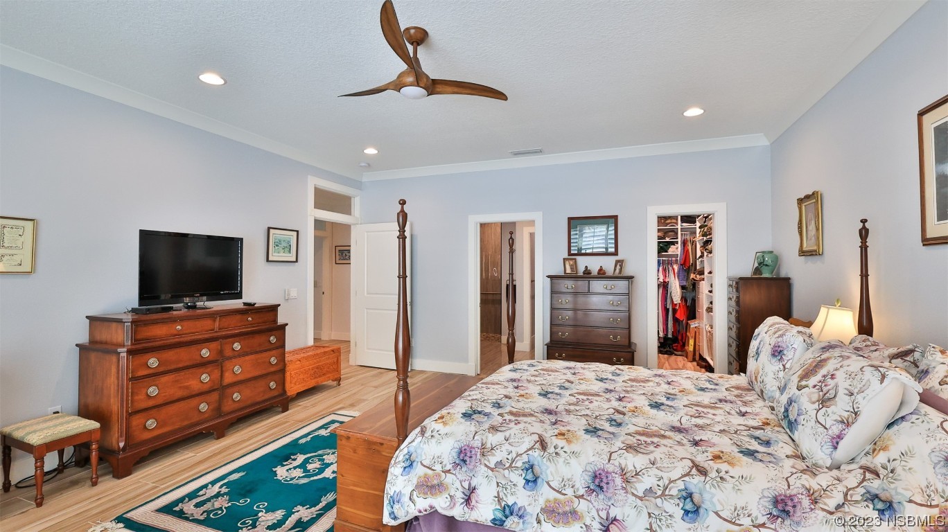 606 Midfield Loop Edgewater, FL 32132 - Photo 26 of 42 a bedroom with furniture and a flat screen tv