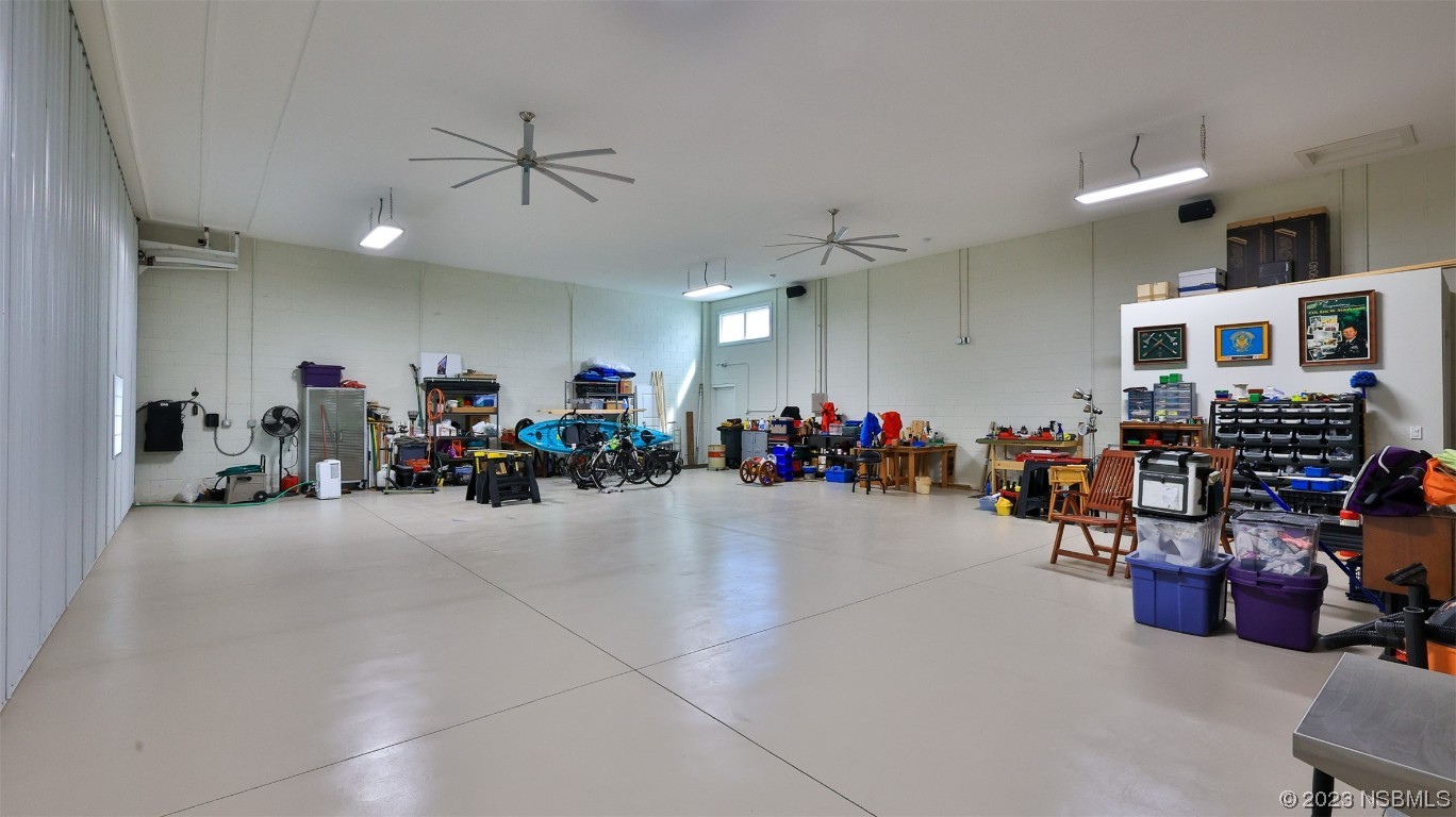 606 Midfield Loop Edgewater, FL 32132 - Photo 39 of 42 a view of a room with gym equipment