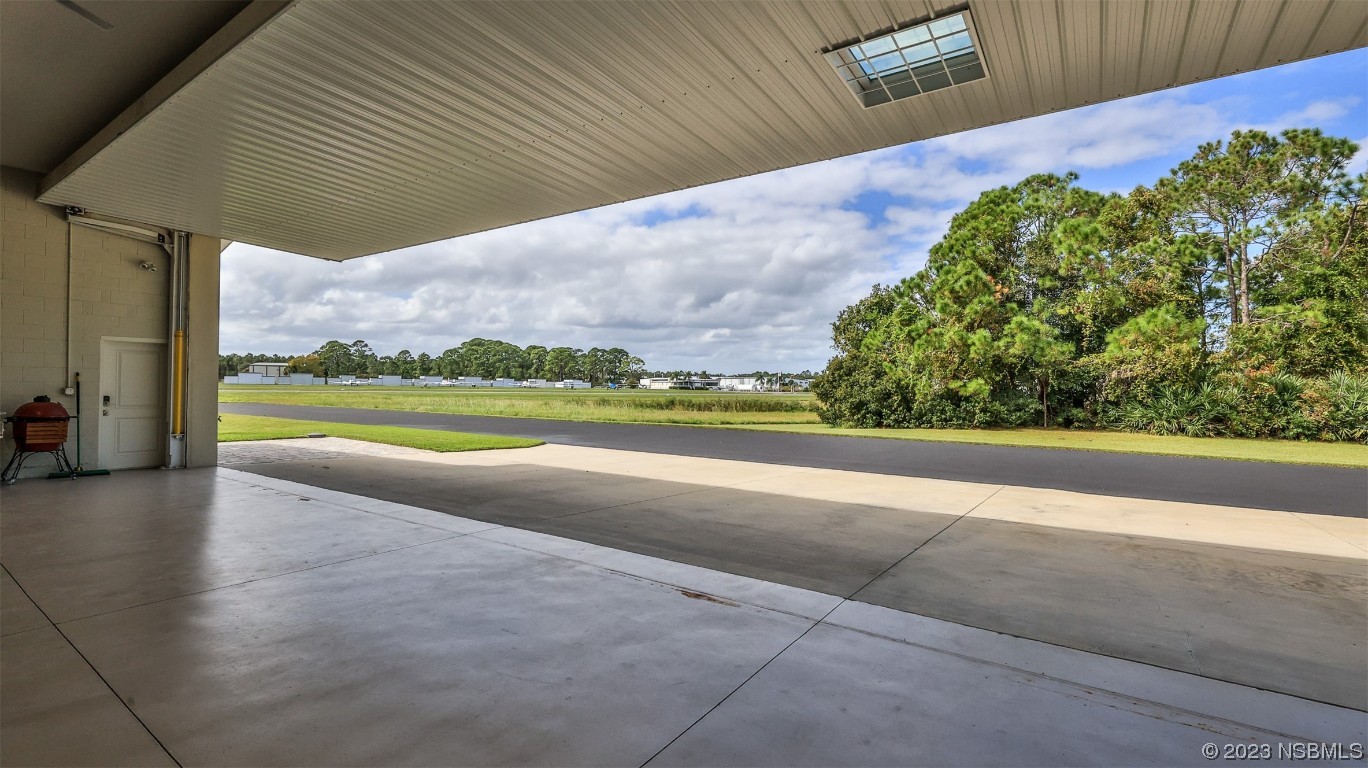 606 Midfield Loop Edgewater, FL 32132 - Photo 10 of 42 a view of a yard with an outdoor space