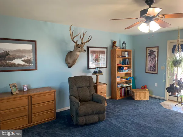 a view of walk in closet with clothes