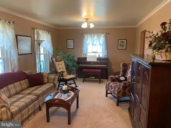 a bedroom with a bed and a dresser with mirror