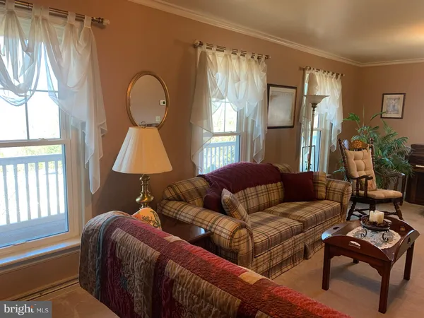 a bedroom with a bed and a dresser in it