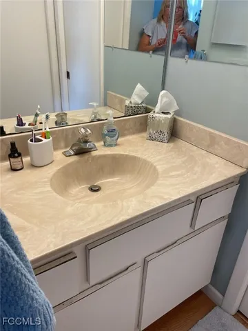 a kitchen with stainless steel appliances granite countertop a sink a stove and refrigerator