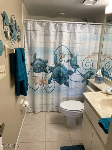 a bathroom with a shower and mirror