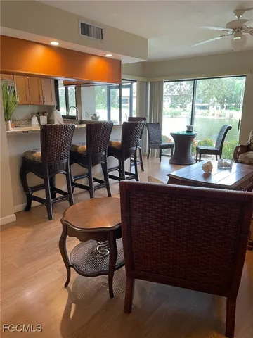 a view of a yard with plants and trees