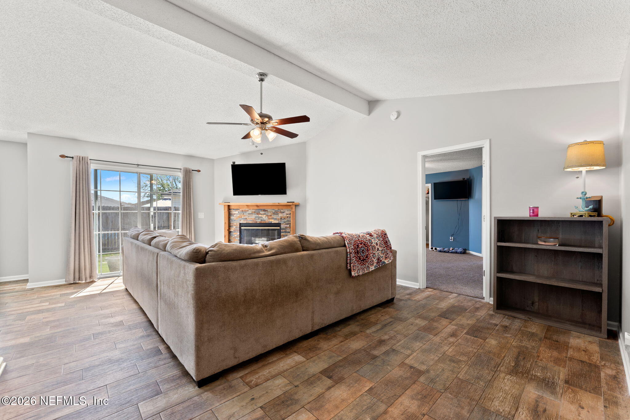 2982 Chief Ridaught Trail Middleburg, FL 32068 - Photo 19 of 29 a living room with furniture and a flat screen tv