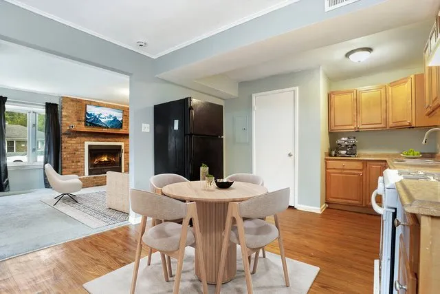 a dining room with furniture and window