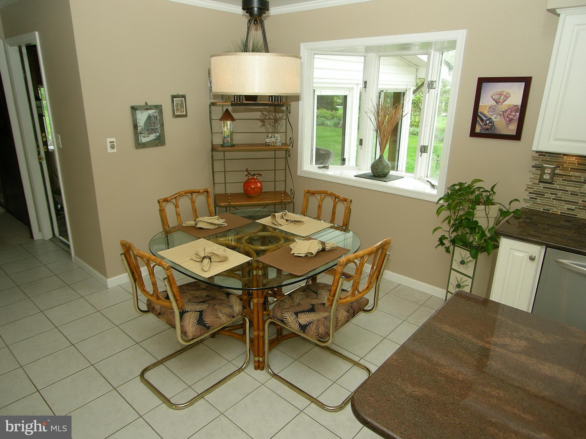 13909 Foxland Road Phoenix, MD 21131 - Photo 8 of 27 a view of a dining room with furniture window and wooden floor
