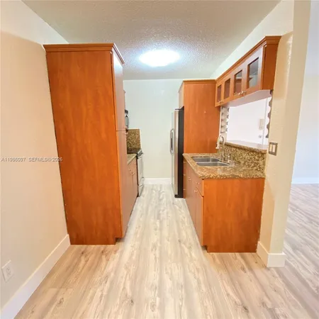 a view of front door with wooden floor