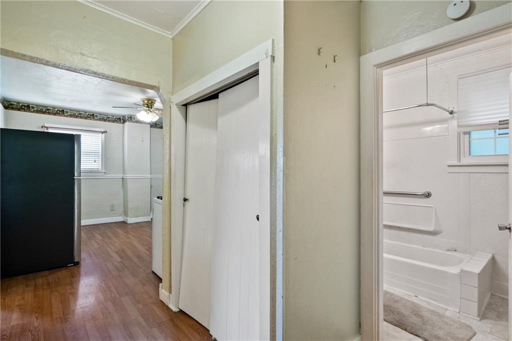223 Hickory Street McKees Rocks, PA 15136 - Photo 13 of 27 a view of a hallway with wooden floor