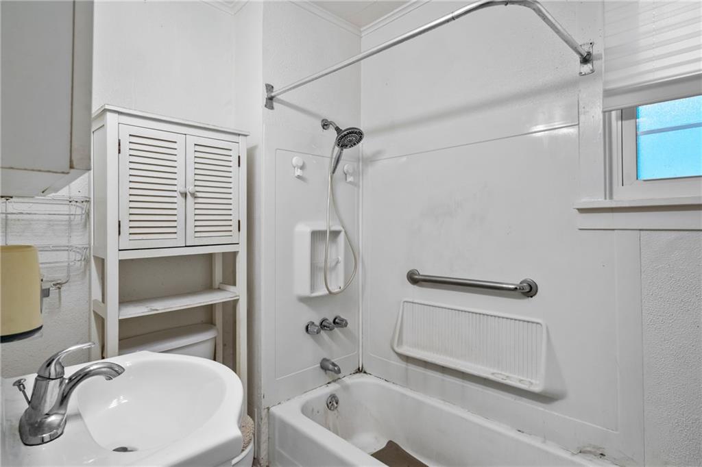 223 Hickory Street McKees Rocks, PA 15136 - Photo 14 of 27 a bathroom with a sink a toilet and shower