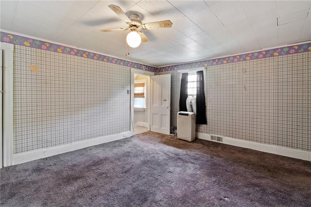 223 Hickory Street McKees Rocks, PA 15136 - Photo 18 of 27 a view of an empty room with wooden floor