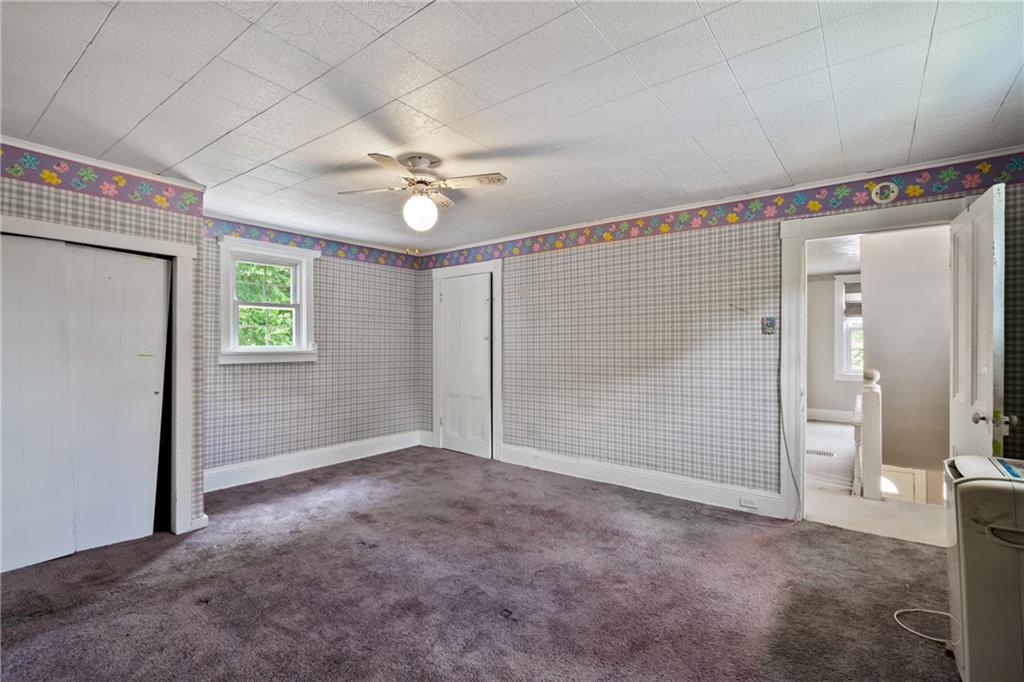 223 Hickory Street McKees Rocks, PA 15136 - Photo 19 of 27 an empty room with windows and fan